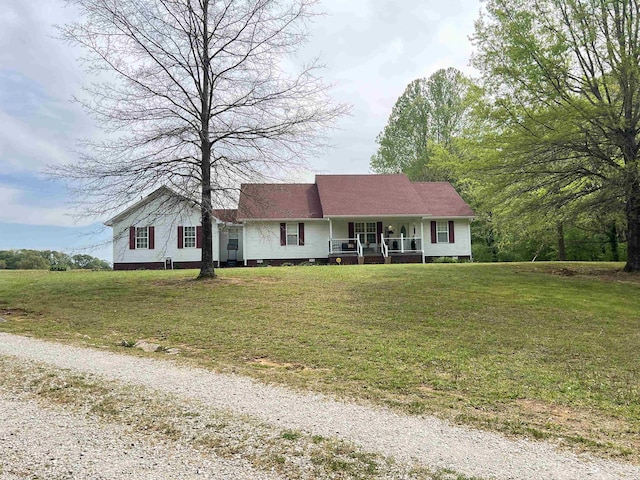 ranch-style home with a porch and a front lawn
