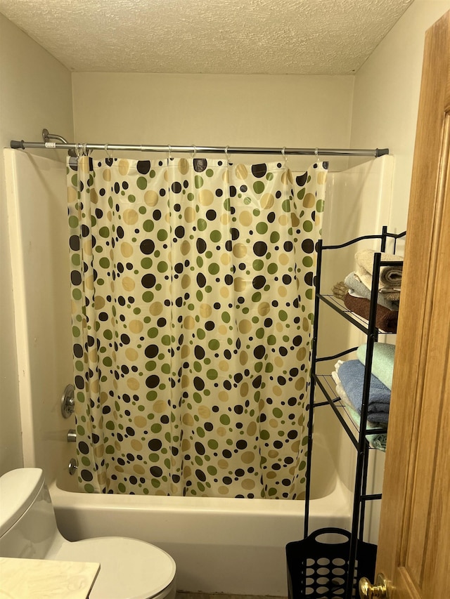 bathroom with shower / tub combo, a textured ceiling, and toilet