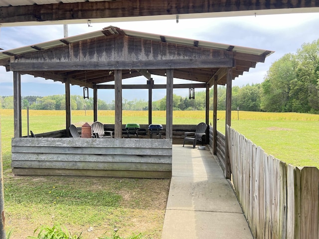 exterior space with a lawn and a rural view