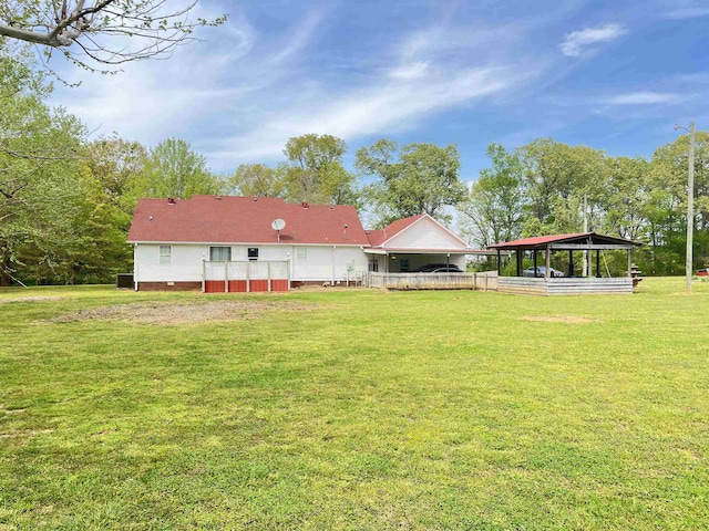 rear view of house featuring crawl space and a yard