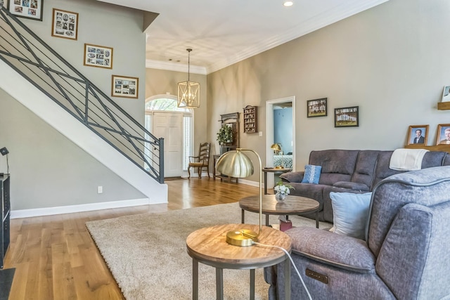 10290 W Shrewsbury Run, Collierville, TN 38017 - living area featuring baseboards, light wood-type flooring, stairs, and a notable chandelier