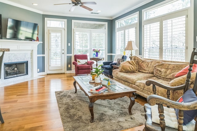 10290 W Shrewsbury Run, Collierville, TN 38017 - living room featuring ornamental molding, a ceiling fan, wood finished floors, and visible vents