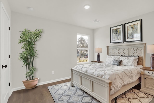 bedroom with baseboards, visible vents, recessed lighting, and dark wood finished floors