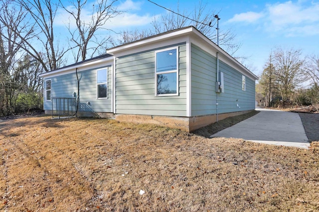 view of property exterior with a patio