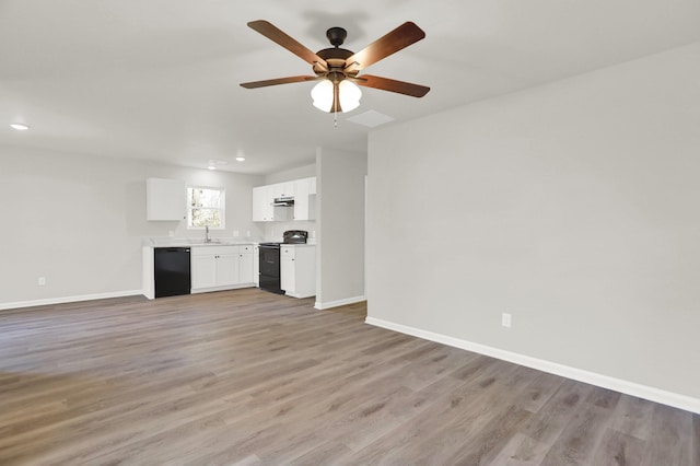 unfurnished living room with light wood finished floors, baseboards, and ceiling fan