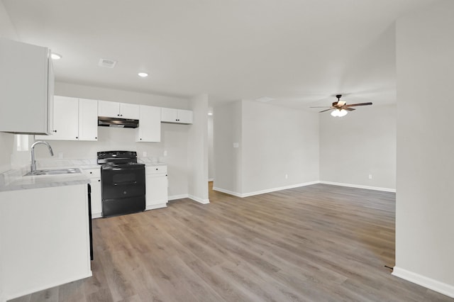 kitchen featuring a ceiling fan, a sink, white cabinetry, electric range, and under cabinet range hood