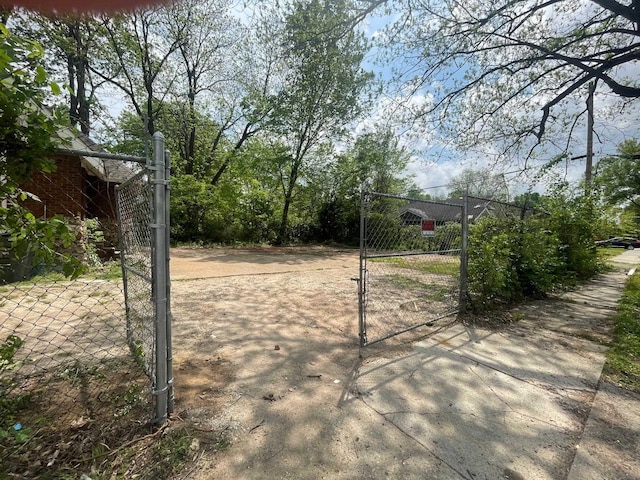 exterior space with a gate and fence