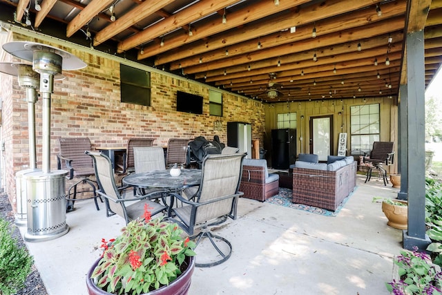view of patio with outdoor lounge area and outdoor dining area