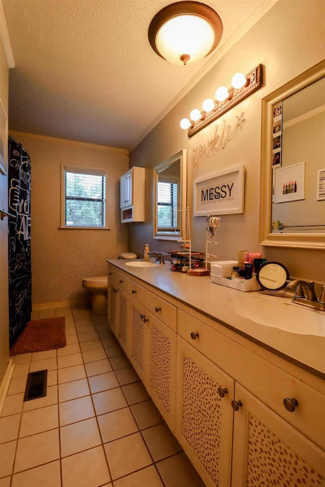 full bathroom with a textured ceiling, crown molding, toilet, and a sink