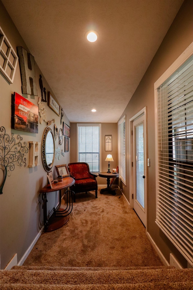 interior space with baseboards, carpet floors, and recessed lighting