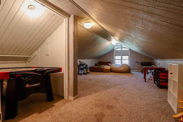 bonus room with lofted ceiling and carpet floors