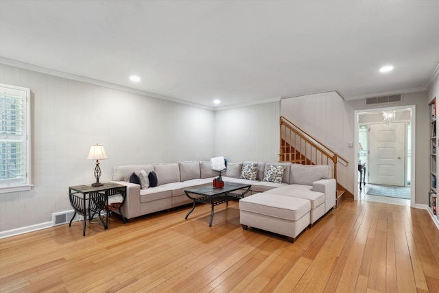 living area with visible vents, recessed lighting, light wood-style floors, stairway, and crown molding