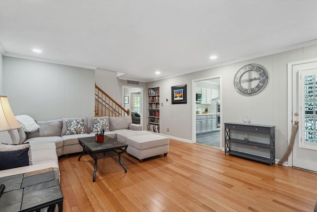 living area with recessed lighting, stairway, hardwood / wood-style floors, and crown molding