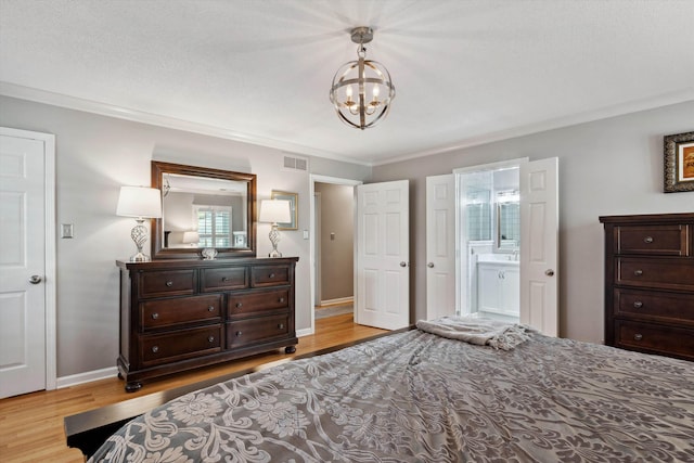 bedroom with ornamental molding, a chandelier, visible vents, and light wood-type flooring