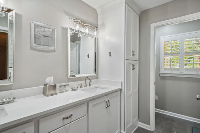 full bathroom featuring baseboards and vanity
