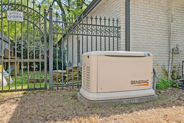 exterior details with brick siding, fence, and a power unit