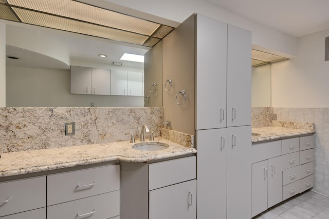 bathroom featuring tile patterned floors and vanity