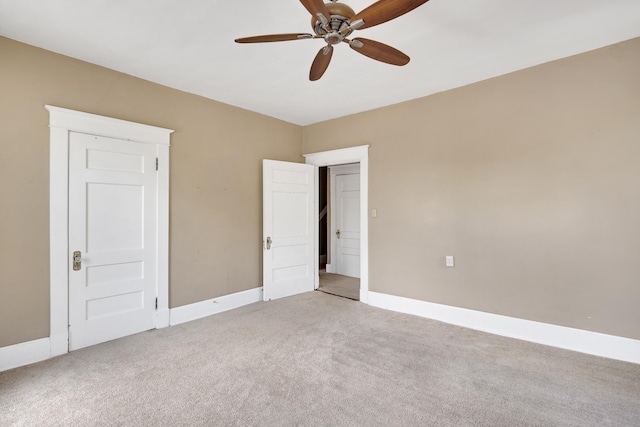 unfurnished bedroom with baseboards, a ceiling fan, and light colored carpet