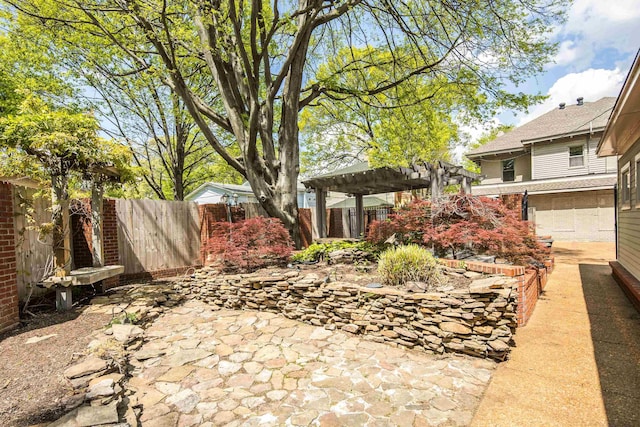 view of yard with a pergola, a fenced backyard, and a patio