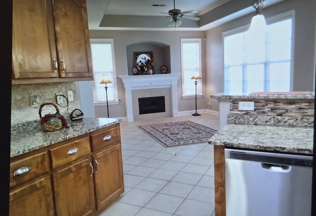 33 Ward Ln, Atoka, TN 38004 - kitchen with stainless steel dishwasher, ceiling fan, backsplash, and a fireplace