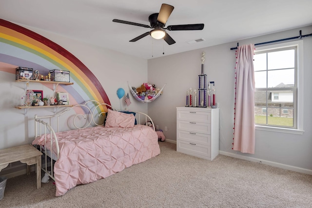 bedroom featuring carpet floors, visible vents, a ceiling fan, and baseboards