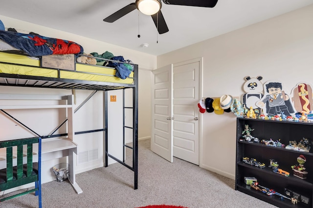 bedroom with carpet floors, visible vents, and baseboards