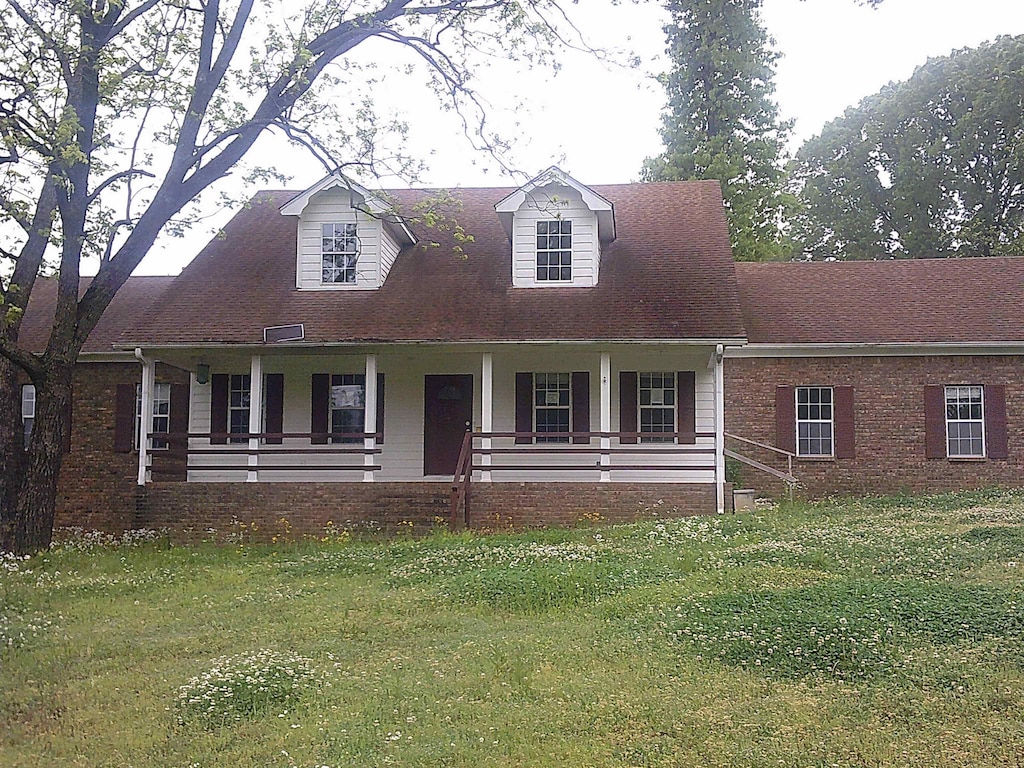 4080 Lucy Rd, Millington, TN 38053 - cape cod home featuring a front lawn and a porch