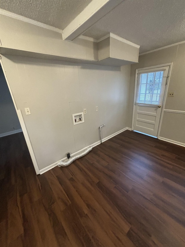laundry room with crown molding, a textured ceiling, dark wood-type flooring, laundry area, and washer hookup