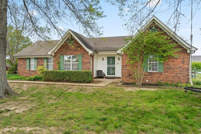 ranch-style house with brick siding and a front yard