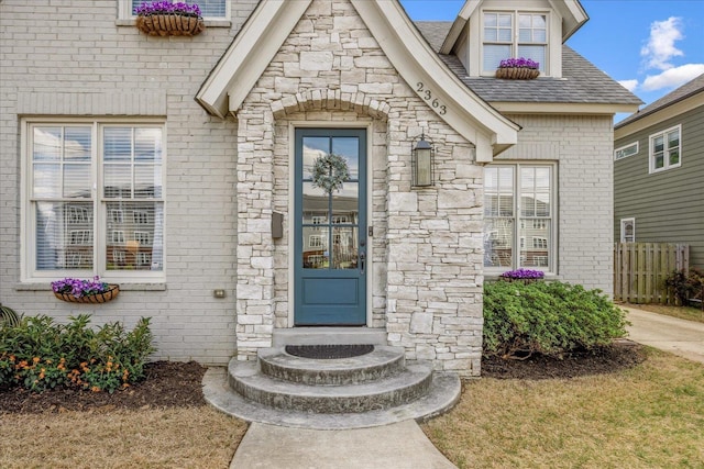 2363 Autumn Ave, Memphis, TN 38112 - entrance to property with fence, brick siding, and stone siding