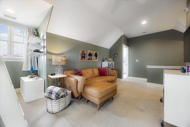 2363 Autumn Ave, Memphis, TN 38112 - living room with light colored carpet, vaulted ceiling, and baseboards