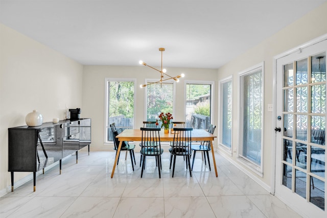 5657 Walnut Grove Rd, Memphis, TN 38120 - dining room with marble finish floor, baseboards, and a chandelier