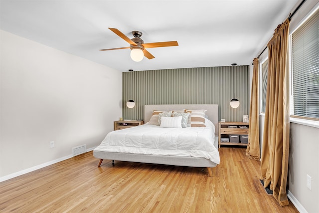 5657 Walnut Grove Rd, Memphis, TN 38120 - bedroom featuring wood finished floors, visible vents, a ceiling fan, and baseboards