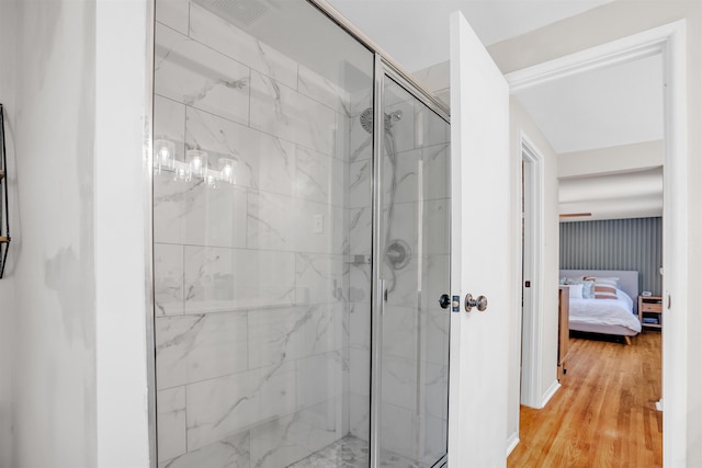 5657 Walnut Grove Rd, Memphis, TN 38120 - full bath featuring wood finished floors, a marble finish shower, and connected bathroom