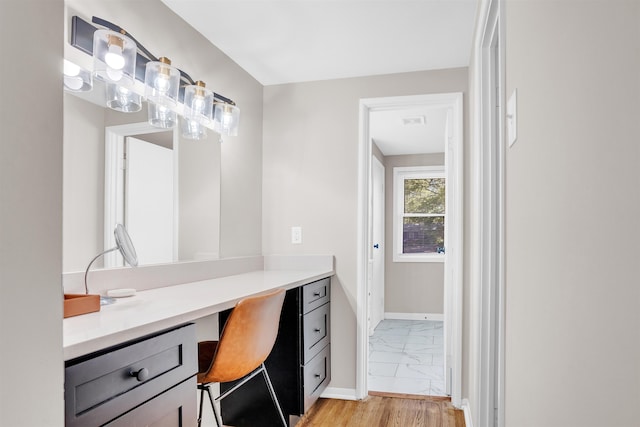5657 Walnut Grove Rd, Memphis, TN 38120 - bathroom featuring baseboards, marble finish floor, and vanity