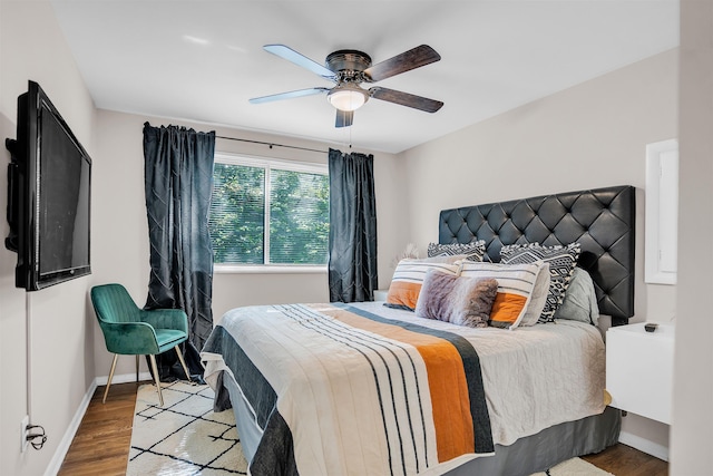 5657 Walnut Grove Rd, Memphis, TN 38120 - bedroom featuring baseboards, a ceiling fan, and wood finished floors