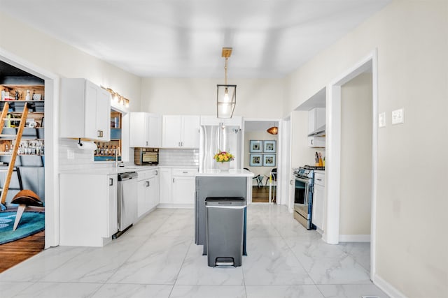 5657 Walnut Grove Rd, Memphis, TN 38120 - kitchen featuring light countertops, marble finish floor, a center island, and stainless steel appliances