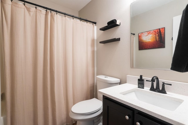 full bathroom with toilet, vanity, and a shower with curtain