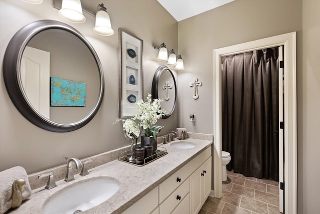 6465 Wynfrey Pl, Memphis, TN 38120 - full bathroom with toilet, a sink, and double vanity