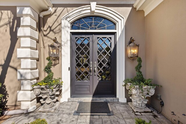 6465 Wynfrey Pl, Memphis, TN 38120 - view of exterior entry with french doors and stucco siding