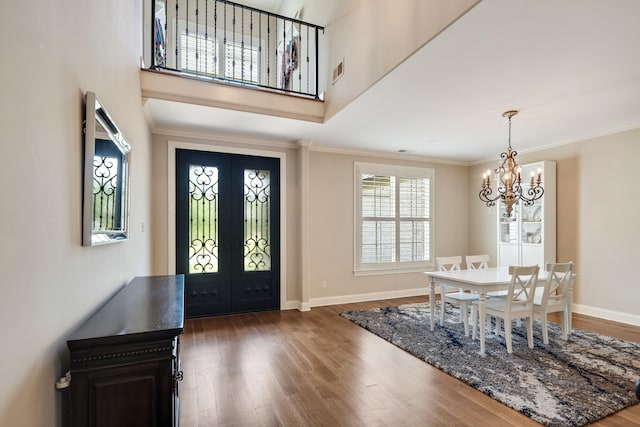 250 Ridgewood Dr, Piperton, TN 38017 - foyer entrance with french doors, wood finished floors, a chandelier, and crown molding