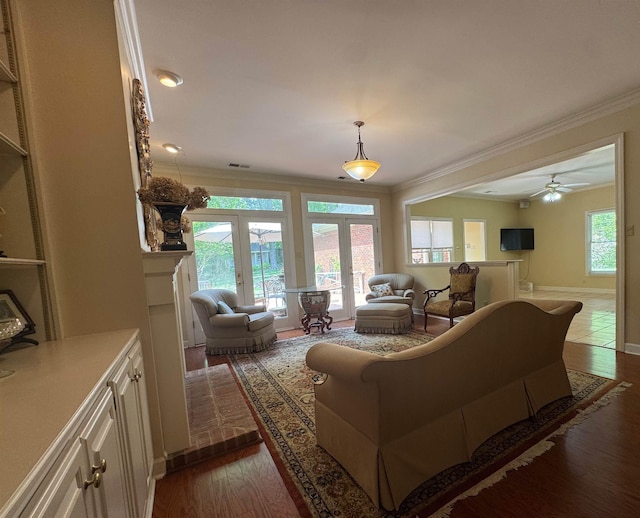 living room with french doors, dark wood finished floors, baseboards, a ceiling fan, and crown molding