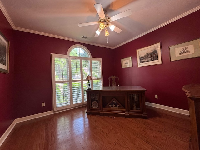 office area with a ceiling fan, wood finished floors, baseboards, ornamental molding, and visible vents