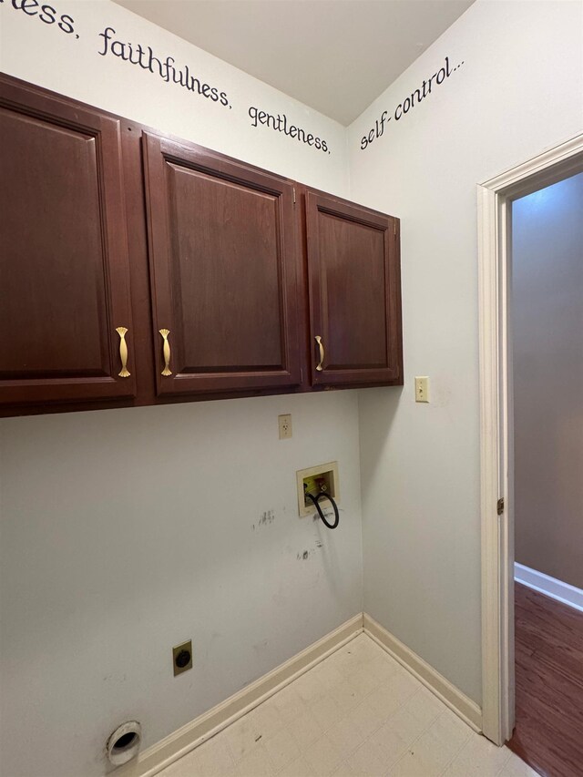 clothes washing area featuring hookup for an electric dryer, baseboards, hookup for a washing machine, cabinet space, and light floors