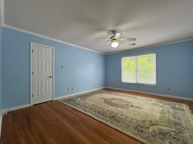 spare room with ceiling fan, baseboards, and wood finished floors