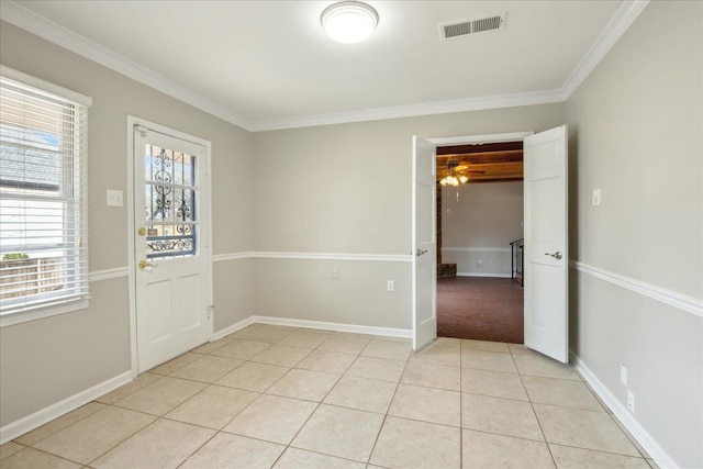 5676 Walnut Grove Pl, Memphis, TN 38120 - empty room with visible vents, a healthy amount of sunlight, ornamental molding, and light tile patterned flooring