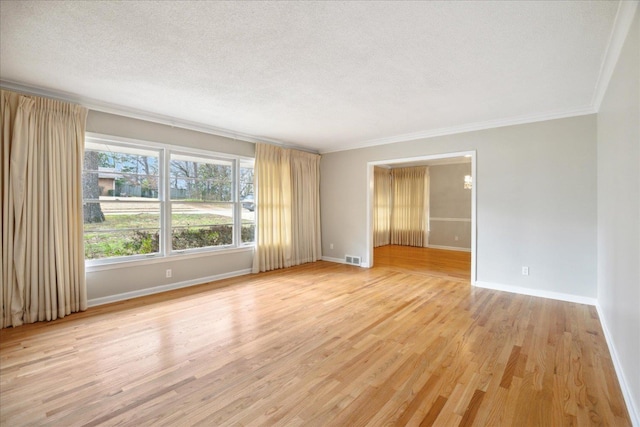 5676 Walnut Grove Pl, Memphis, TN 38120 - unfurnished room with baseboards, a textured ceiling, and ornamental molding