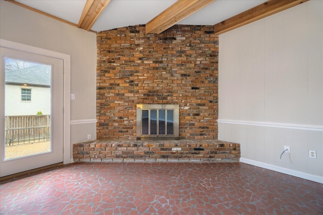 5676 Walnut Grove Pl, Memphis, TN 38120 - unfurnished living room featuring stone finish flooring and beamed ceiling