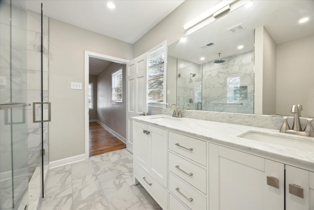 5676 Walnut Grove Pl, Memphis, TN 38120 - bathroom with visible vents, marble finish floor, a marble finish shower, and a sink