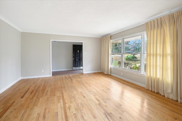 5676 Walnut Grove Pl, Memphis, TN 38120 - empty room with light wood-type flooring, baseboards, and ornamental molding
